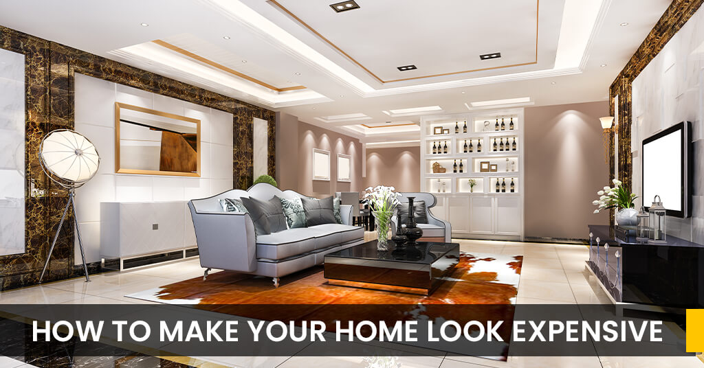 Bedroom lighting, furniture, and decorative curtain artwork from Half Price Furniture. Living room styled with artwork, stylish grey lounge, curved sofa, and decorative elements — all from Half Price Furniture.