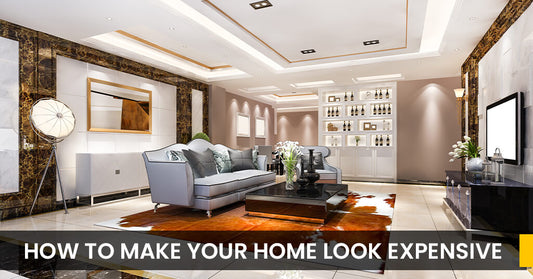 Bedroom lighting, furniture, and decorative curtain artwork from Half Price Furniture. Living room styled with artwork, stylish grey lounge, curved sofa, and decorative elements — all from Half Price Furniture.