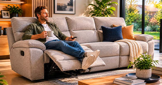 Man relaxing on modern reclining sofa in contemporary living room