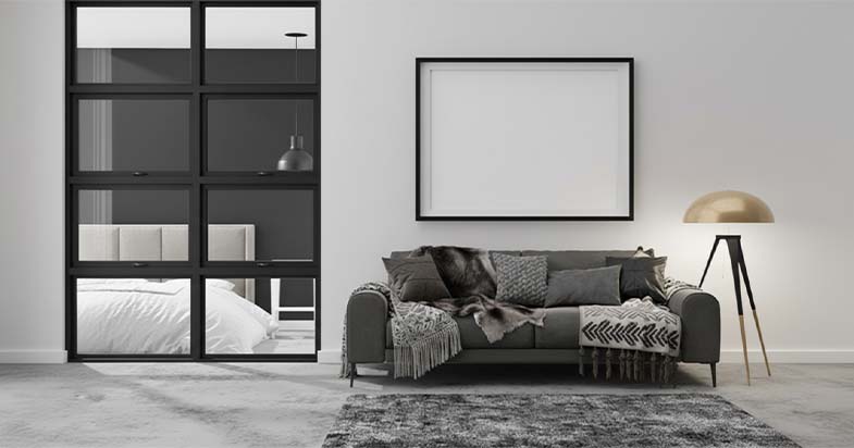 Best Furniture Deals in the Furniture Castle Black Friday Sale 2025. Image of a white and turquoise patterned desk with gold hairpin legs against a pink wall.