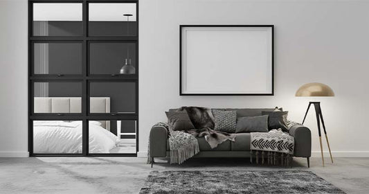 Best Furniture Deals in the Furniture Castle Black Friday Sale 2025. Image of a white and turquoise patterned desk with gold hairpin legs against a pink wall.