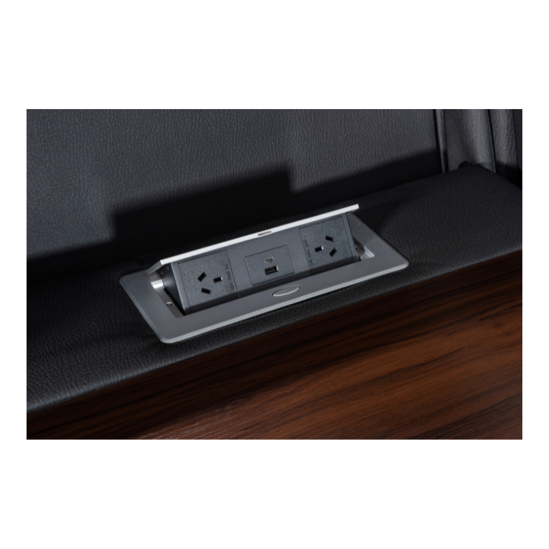 Excaliber 3-Seater Lounge with cooling cup holder and electric outlet, set in a luxurious interior.