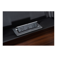 Excaliber 3-Seater Lounge with cooling cup holder and electric outlet, set in a luxurious interior.