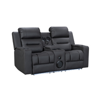 Excaliber 2-Seater Lounge with smart cup holder and arm storage, displayed in a chic entertainment room.