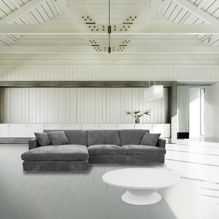 Licorice Brody Fab 2.5 Seater with LHF Chaise, featuring sleek arms and polyester fabric, in a stylish space.