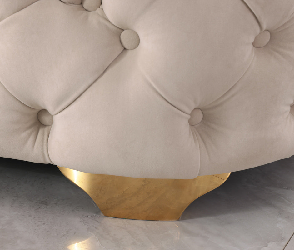 Beige velvet lounge with S spring support and plush filling, set in a cozy lounge.