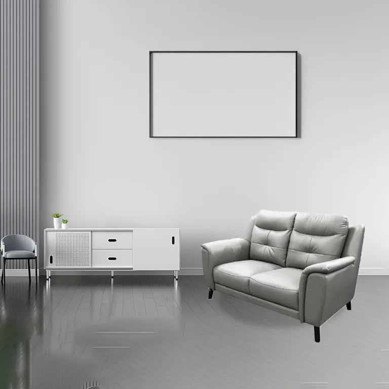 Stylish 2 seater lounge leather featuring side pillow arms, dark walnut timber legs, and premium leather for a sleek, contemporary design.