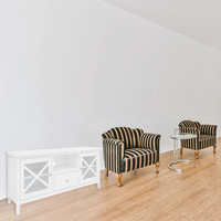 Hamptons-style TV unit with metal runners and black felt drawers, displayed in a sophisticated lounge.