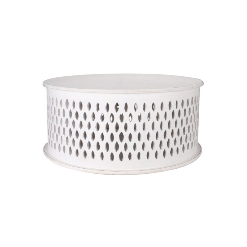 Round coffee table with natural textures and crafted details, displayed in a stylish contemporary lounge.