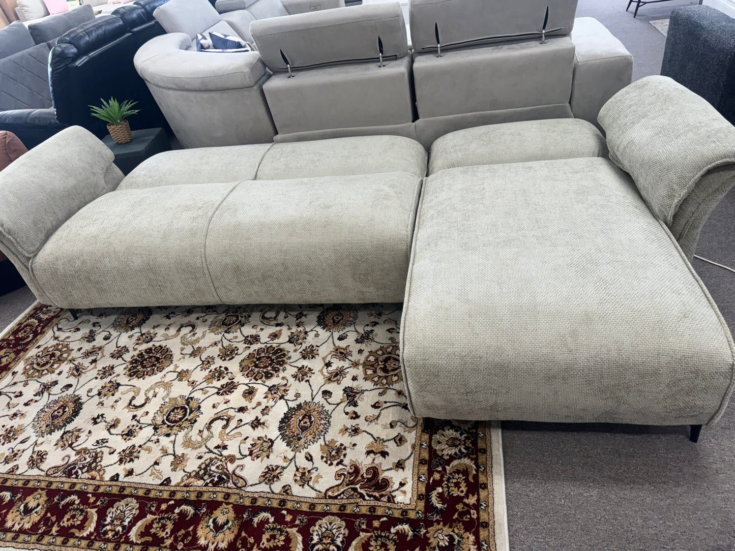 Tan air leather Nile Reversal Sofabed, designed for versatility, in a trendy living space.