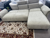 Tan air leather Nile Reversal Sofabed, designed for versatility, in a trendy living space.