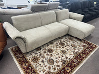 Beige Nile Reversal Sofabed with polyester upholstery, set in a functional guest room.