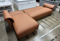 Tan air leather Nile Reversal Sofabed, perfect for small spaces, in a contemporary setting.