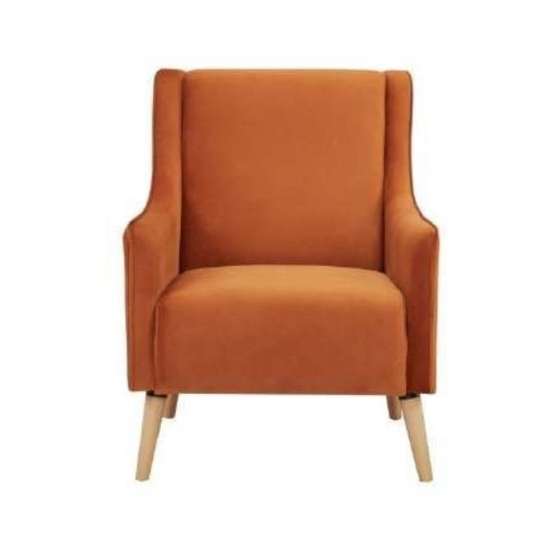 Polyester-upholstered armchair with plywood frame and timber legs, set in a trendy room.