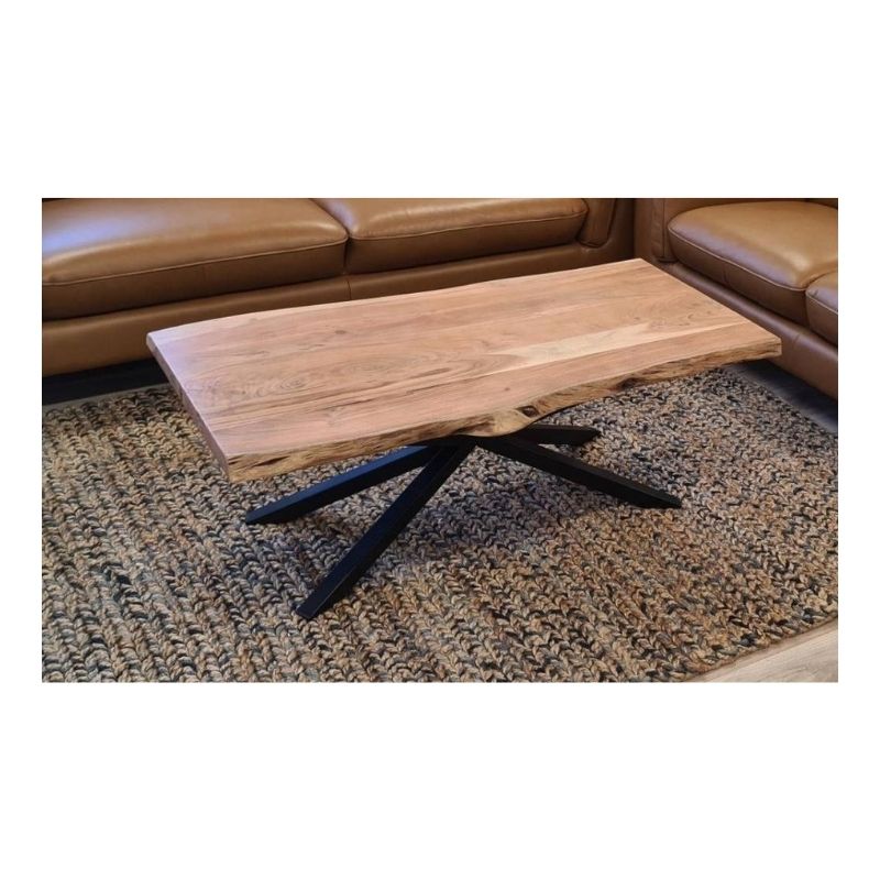 Live edge acacia coffee table with black steel legs and natural grain, set in a contemporary living room.