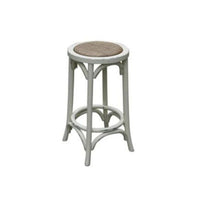 Versatile Baker Stool with oak and metal design, displayed in a stylish living room.