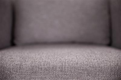 Cozy swivel chair featuring pine frame, high-density foam, durable polyester upholstery, cushions, and ottoman.