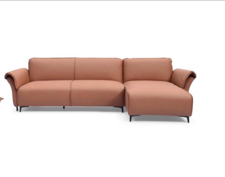 Tan Nile Reversal Sofabed in air leather, combining comfort and style, in a chic lounge.
