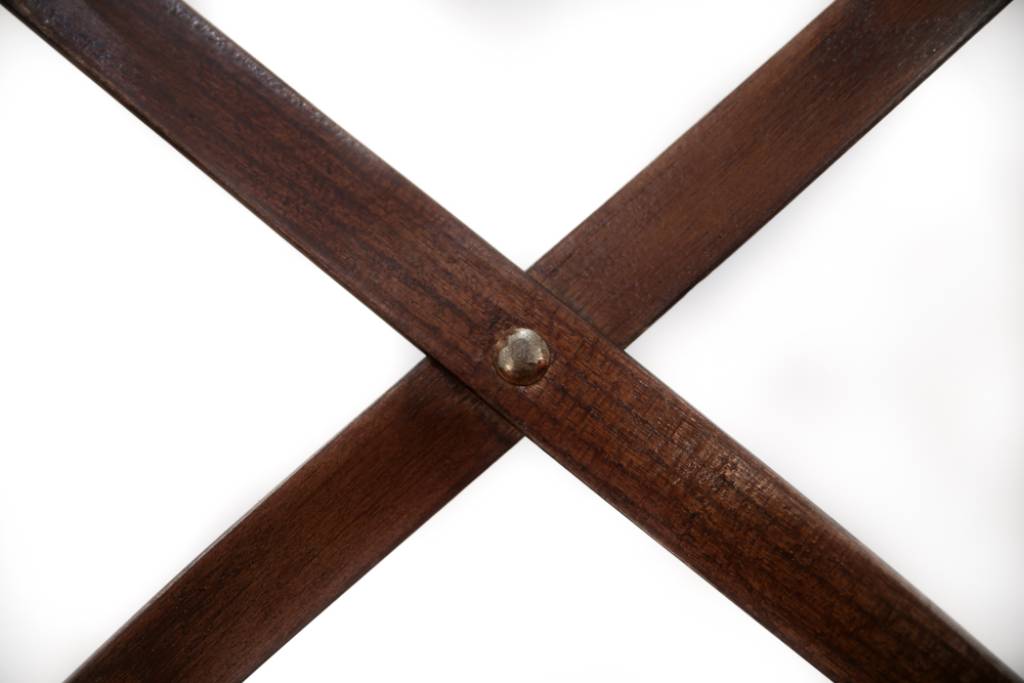 Durable timber dining chair with cross back design, displayed in a high-traffic dining area.