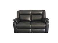 Black Peggy 2ERER LTH Recliner with padded armrests and premium leather, enhancing a cozy space.