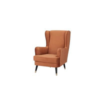 Armchair with high-resilience foam and pine frame, set in a versatile living room.
