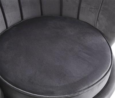 Serena Armchair with plush upholstery and coordinating ottoman, enhancing a contemporary lounge.