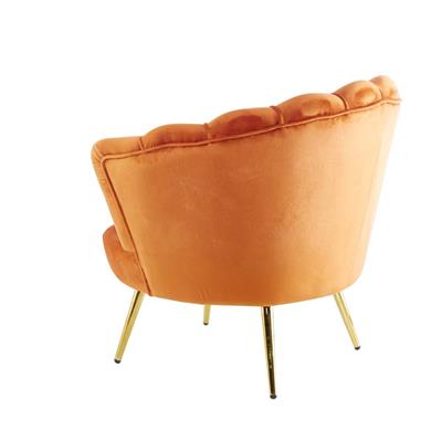 Artic Velvet Armchair with sturdy frame and gold-finished legs, set in a modern living space.