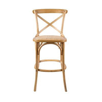 Cloak Bar Stool with steam-bent frame and woven seat, displayed in a versatile dining space.