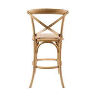 Cloak Bar Stool with durable birch and natural rattan, enhancing a contemporary dining room.