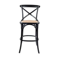 Cloak Bar Stool with birch timber frame and rattan seat, set in a modern dining space.