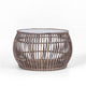 Luna coffee table with glass top and natural weave, set in a relaxed indoor living room.