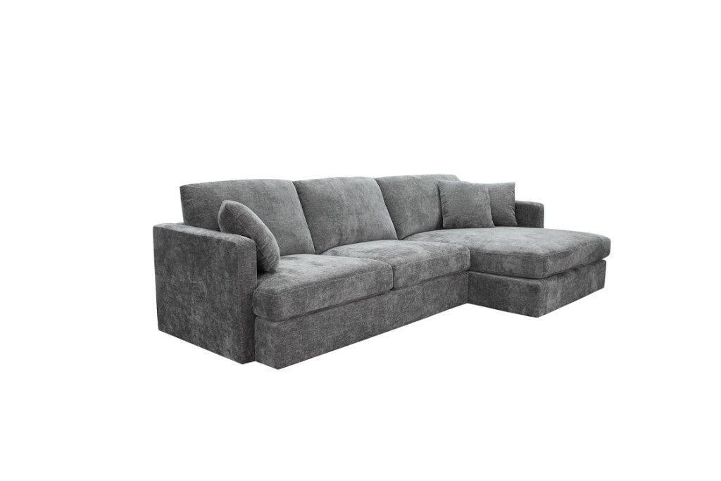 Slate Brody Fab 2.5 Seater with RHF Chaise and three scatter cushions, placed in a modern living room.