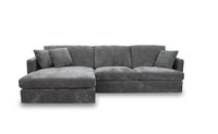 Slate Brody Fab 2.5 Seater with LHF Chaise and three scatter cushions, set in a modern living room.