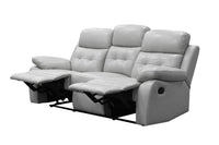 Silver Cosmic 3S Lounge with corrected grain leather and lumbar support, in a cozy space.
