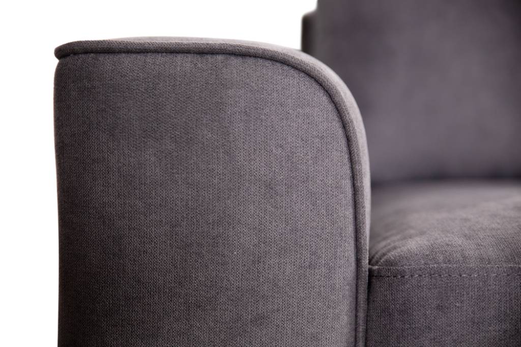 Comfortable fabric corner lounge with high-density foam seating and a sleek dark grey finish, perfect for contemporary homes.