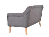 Muted Orange Lavender 2.5 Seater featuring a single cushion and piping, positioned in a vibrant living room.