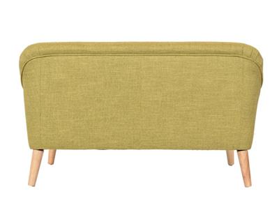 Blue Lavender 2.5 Seater with angled oak legs and five-button detailing, enhancing a stylish home environment.