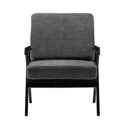 Mid-century armchair with hardwood frame, slatted backrest, high-density foam, and plush sheepskin-look upholstery for stylish, comfortable lounging.